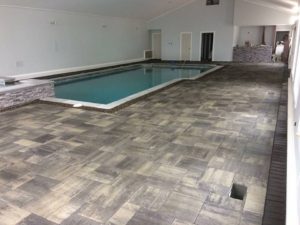 A pool in the middle of an indoor area.